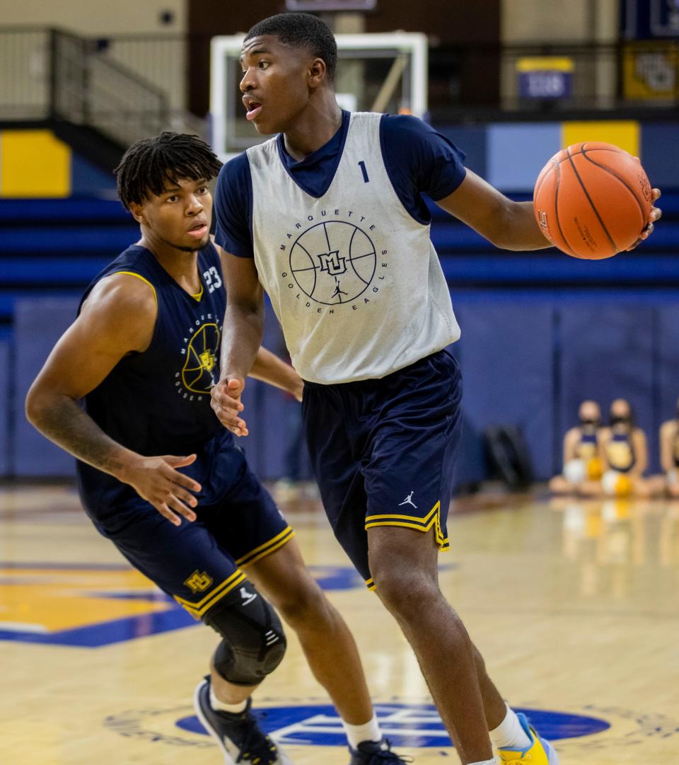 Marquette's David Joplin, left, and Kam Jones have been roommates for two years and are constantly pushing each other.