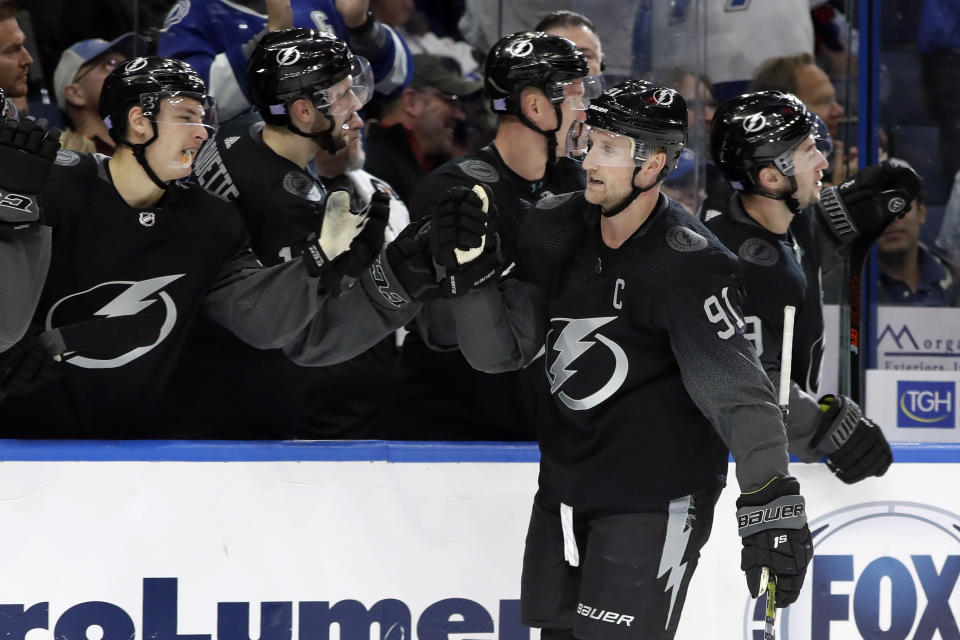 Tampa Bay Lightning center Steven Stamkos (91) celebrates with the bench after his goal against the Winnipeg Jets during the third period of an NHL hockey game Saturday, Nov. 16, 2019, in Tampa, Fla. (AP Photo/Chris O'Meara)