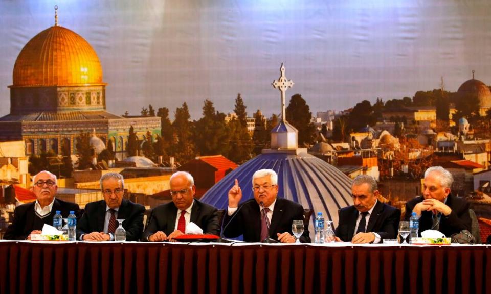 The Palestinian president, Mahmud Abbas, centre, gestures as he delivers a speech in the West Bank city of Ramallah following the announcement of the US Middle East peace plan.