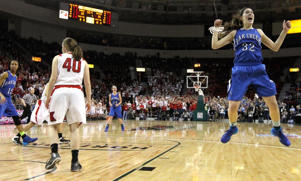 Oak Creek's Stephanie Kostowicz reacts after hitting a last-second shot to send the game into overtime in the Division 1 semifinal on Friday, March 21, 2014, at the Resch Center in Ashwaubenon. Oak Creek beat Kimberly, 46-40, in overtime.