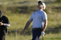 Louis Oosthuizen, of South Africa, reacts to a poor shot on the 18th hole during the second round of the PGA Championship golf tournament on the Ocean Course Friday, May 21, 2021, in Kiawah Island, S.C. (AP Photo/Chris Carlson)