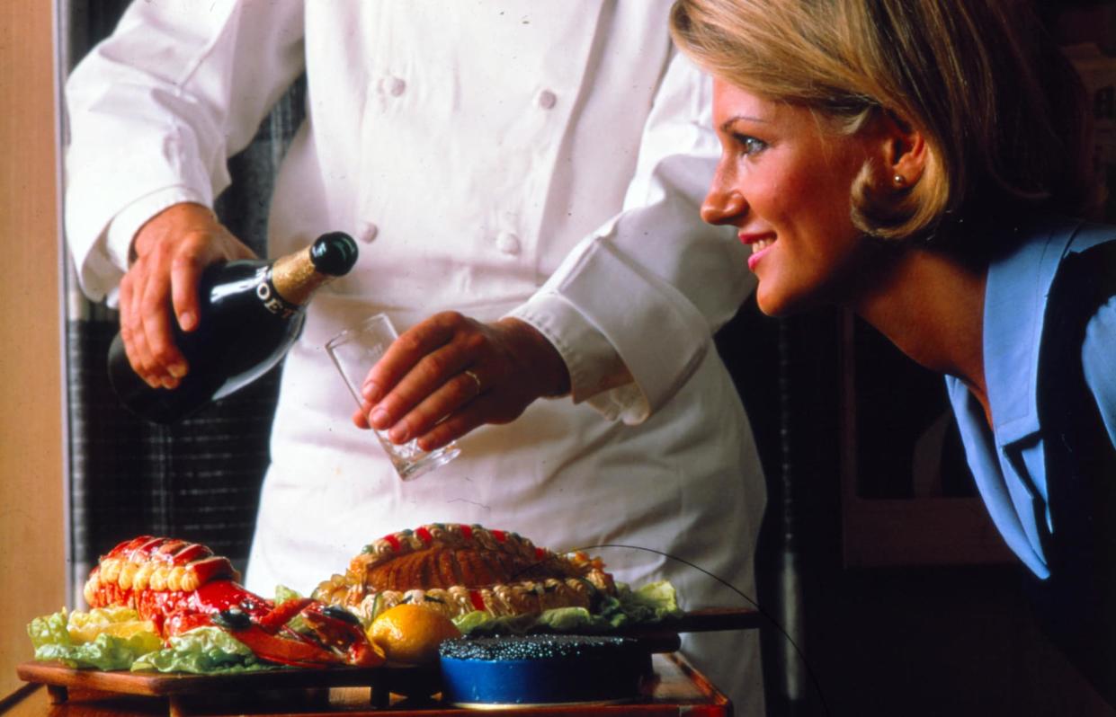 A lobster dinner being served with a glass of Moët Champagne in first class in the Seventies - SAS MUSEUM