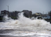 Waves batter the shore in Cow Bay, Nova Scotia, on Wednesday, Sept. 23, 2020. Hurricane Teddy has impacted the Atlantic region as a post-tropical storm, bringing rain, wind and high waves. (Andrew Vaughan/The Canadian Press via AP)