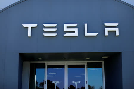 FILE PHOTO: A Tesla sales and service center is shown in Costa Mesa, California, U.S., June 28, 2018. REUTERS/Mike Blake/File Photo