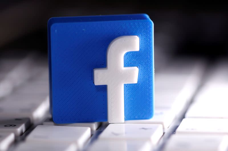 FILE PHOTO: A 3D-printed Facebook logo is seen placed on a keyboard in this illustration