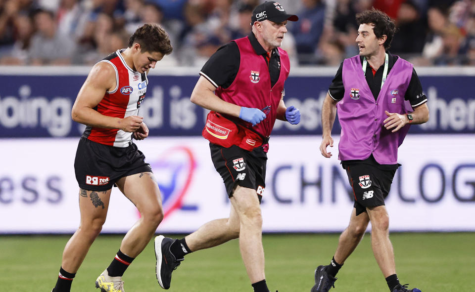 Liam Stocker, pictured here leaving the field after the collision with Patrick Dangerfield.