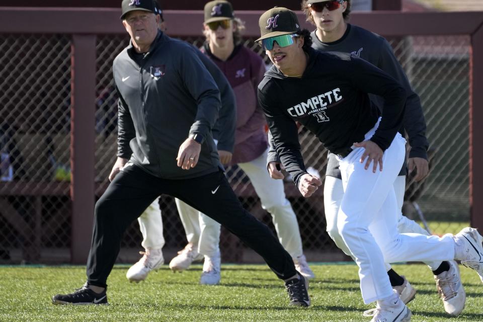 Hamilton INF Cooper Bass (right) runs a drill during practice in Chandler on Feb. 15, 2023.