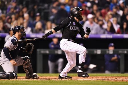 May 11, 2018; Denver, CO, USA; Colorado Rockies center fielder Charlie Blackmon (19) singles in the fourth inning against the Milwaukee Brewers at Coors Field. Mandatory Credit: Ron Chenoy-USA TODAY Sports