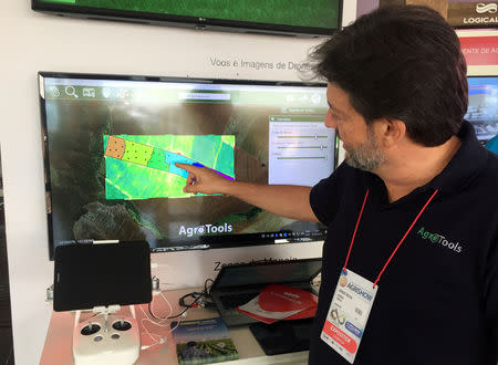 FILE PHOTO: Sergio Rocha, CEO of AgroTools, points at a product of the company during the Agrishow farm fair in Ribeirao Preto, Brazil May 1, 2019. Picture taken May 1, 2019. REUTERS/Marcelo Teixeira/File Photo