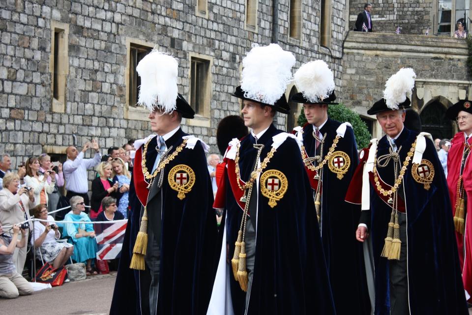 Prince Andrew, Prince Edward, Prince William, and Prince Charles walking in the Order of the Garter procession to St. George’s Chapel at Windsor.