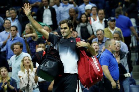 Tennis - US Open - Quarterfinals - New York, U.S. - Roger Federer of Switzerland waves to crowd after losing his match to Juan Martin del Potro of Argentina. REUTERS/Shannon Stapleton