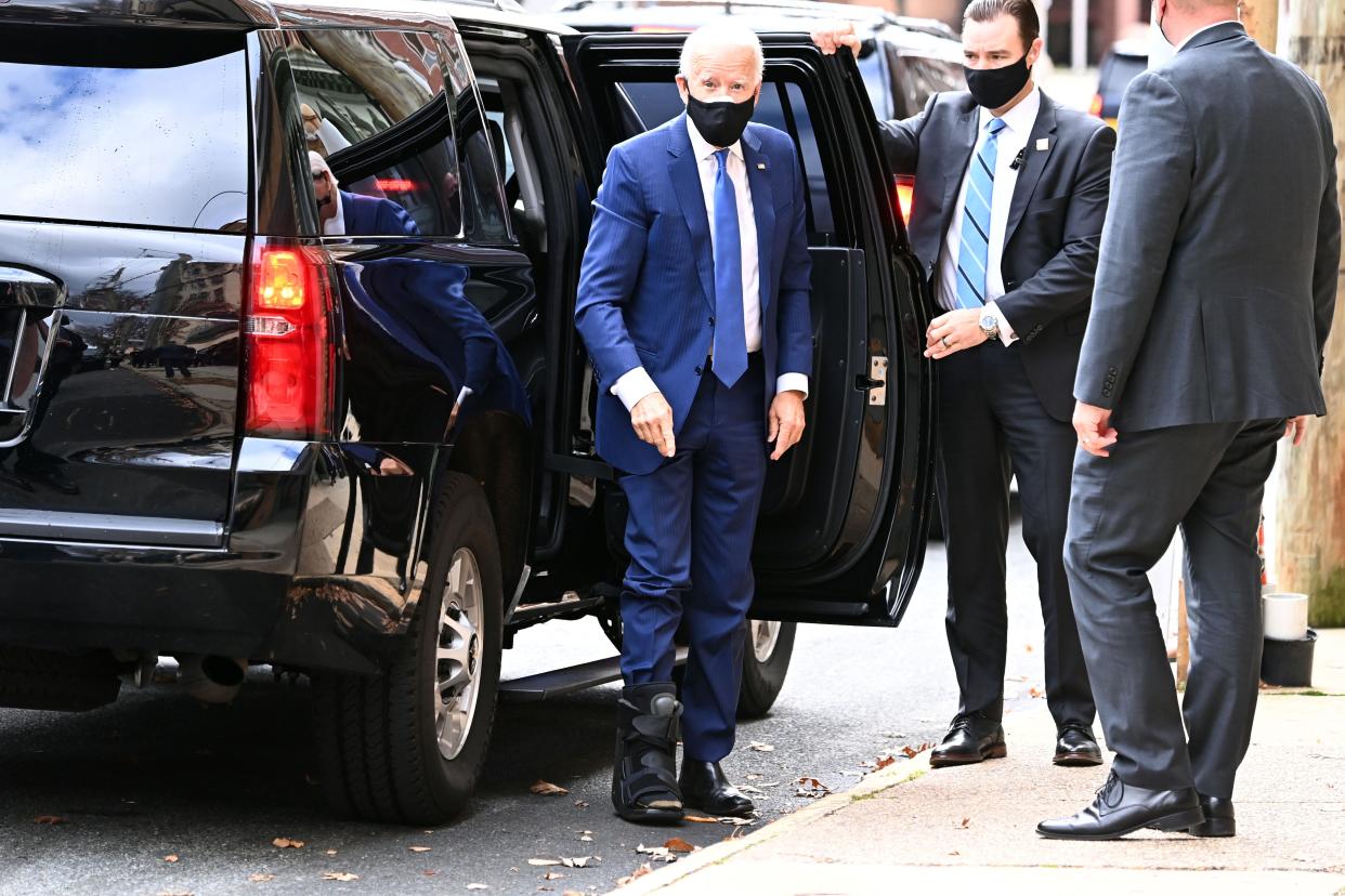 Biden shows off walking boot for fractured foot and insists he’s feeling ‘good’ (AFP via Getty Images)