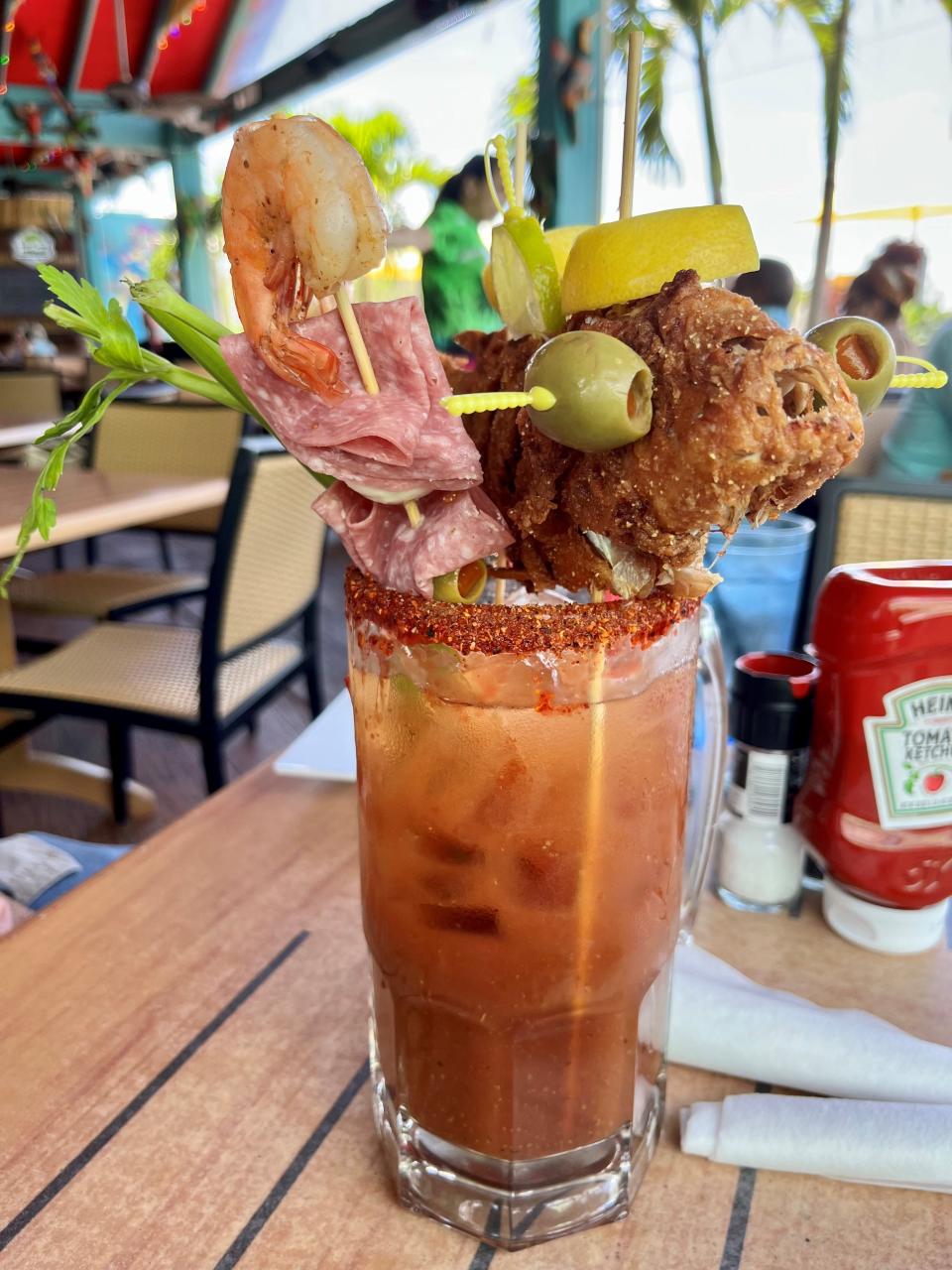 Parrot Key Caribbean Grill's Monster Marys come topped with whole snapper, cheeseburger sliders or bacon grilled cheese.