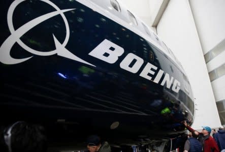 Employees are pictured as the first Boeing 737 MAX 7 is unveiled in Renton, Washington, U.S. February 5, 2018. REUTERS/Jason Redmond