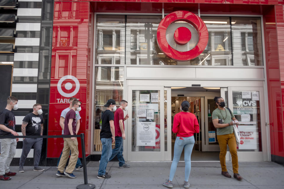 NEW YORK, NEW YORK - MAY 16: People wearing masks avoid social distancing as they wait in line to enter Target in Herald Square  amid the coronavirus pandemic on May 16, 2020 in New York City. COVID-19 has spread to most countries around the world, claiming over 312,000 lives with over 4.7 million cases. (Photo by Alexi Rosenfeld/Getty Images)