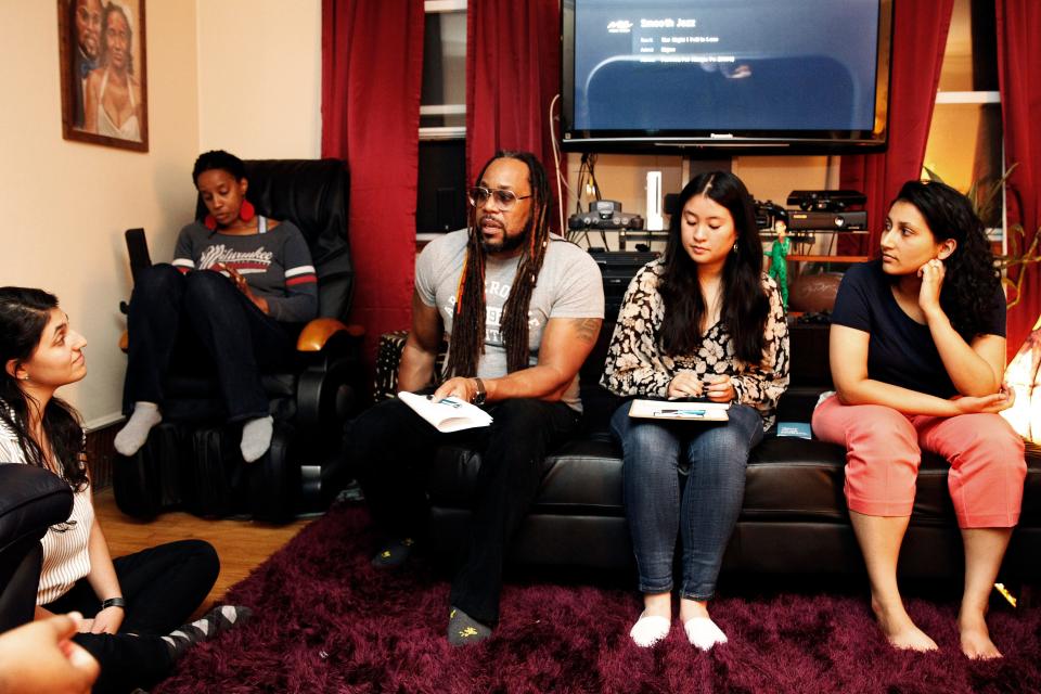 James Causey, third from left, leads a discussion on race during a Table Talk at the home on Thursday, Oct. 10, 2019. The Journal Sentinel reporter and his wife Damia Causey hosted an "On The Table MKE" discussion on "Race and Millennial" at their home. Hundreds of conversations took place all across the city on a variety of topics including: education; health and health care; economic opportunity and development; homelessness and evictions; employment and the justice system and public safety. The talks are sponsored by The Greater Milwaukee Foundation and is designed to turn ideas into action.