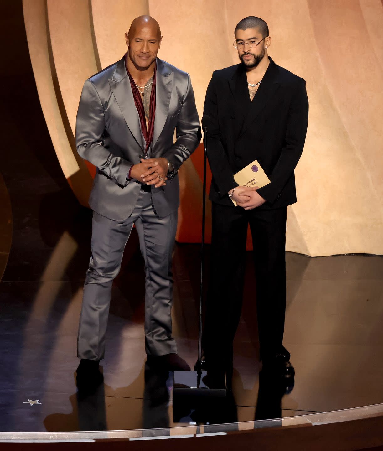 hollywood, california march 10 l r dwayne johnson and bad bunny speak onstage during the 96th annual academy awards at dolby theatre on march 10, 2024 in hollywood, california photo by kevin wintergetty images
