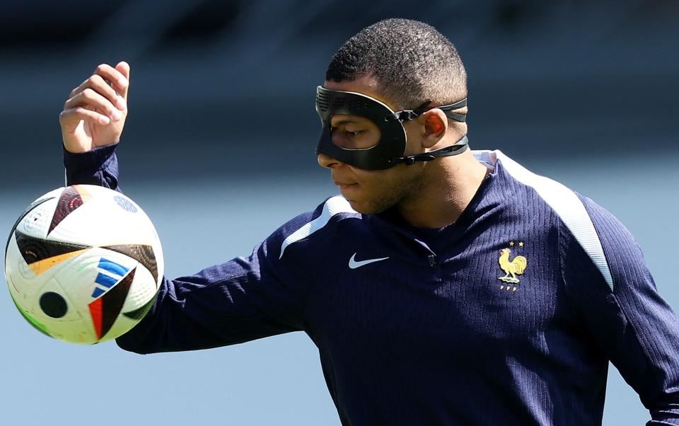 Kylian Mbappe wearing his mask