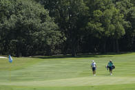 Dustin Johnson walks to the 12th green during practice for the Charles Schwab Challenge golf tournament at the Colonial Country Club in Fort Worth, Texas, Wednesday, June 10, 2020. (AP Photo/David J. Phillip)