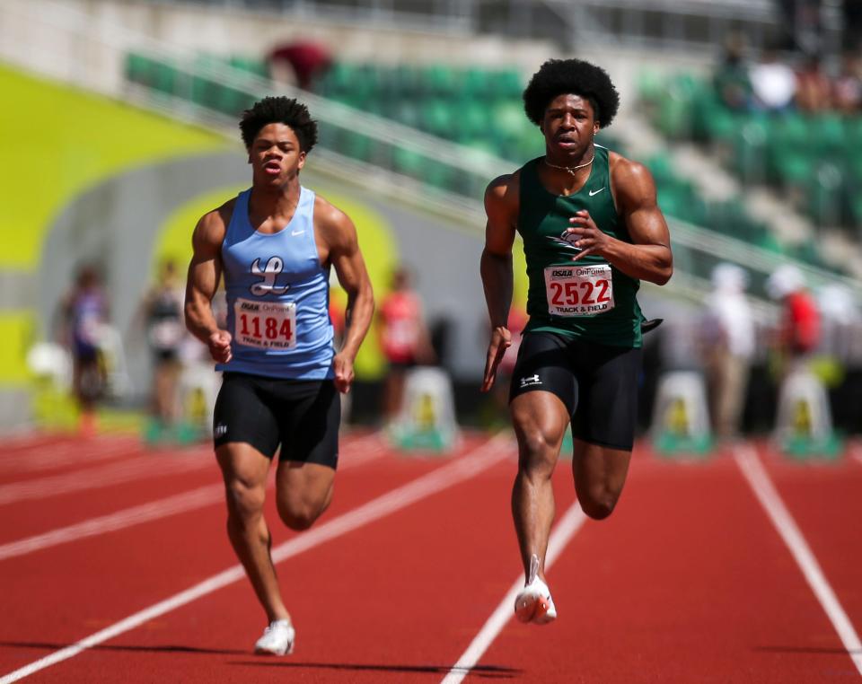 West Salem’s Mihaly Akpamgbo, center, competes in the 100 meter prelims in the OSAA 6A state championships on Friday, May 17, 2024 at Hayward Field in Eugene, Ore.