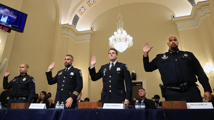 L-R) US Capitol Police officer Sgt. Aquilino Gonell, DC Metropolitan Police Department officer Michael Fanone, DC Metropolitan Police Department officer Daniel Hodges and US Capitol Police officer Harry Dunn are sworn in prior to testifying during the Select Committee investigation of the January 6, 2021, attack on the US Capitol, during their first hearing on Capitol Hill in Washington, DC, on July 27, 2021.(Chip Somodevilla/AFP via Getty Images)
