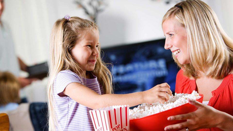 mother and daughter having movie night