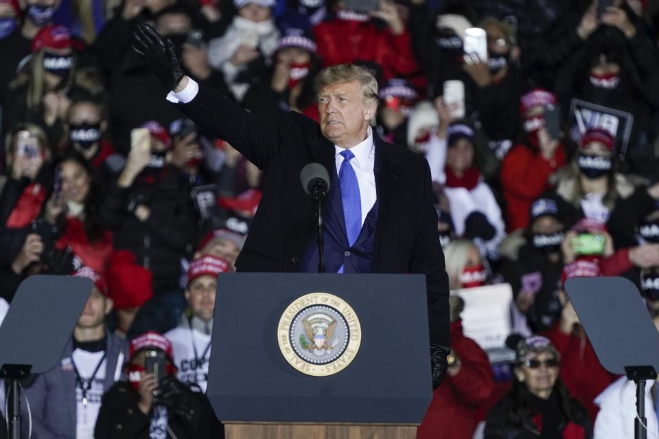 President Donald Trump waves after speaking at a campaign rally at the Waukesha County Airport Saturday, Oct. 24, 2020, in Waukesha, Wis. (AP Photo/Morry Gash)