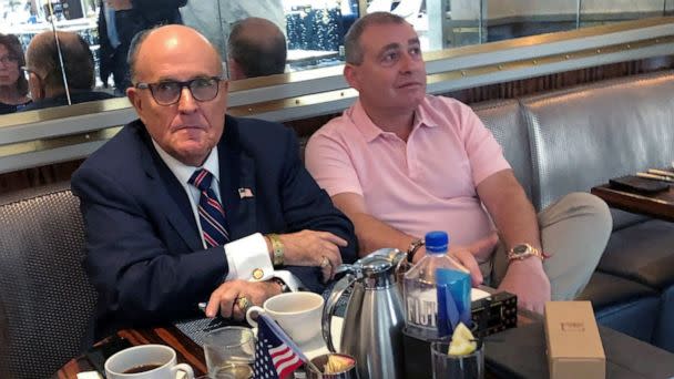 PHOTO: President Trump's personal lawyer Rudy Giuliani with Ukrainian-American businessman Lev Parnas at the Trump International Hotel in Washington, D.C., Sept. 20, 2019. (Aram Roston/Reuters)