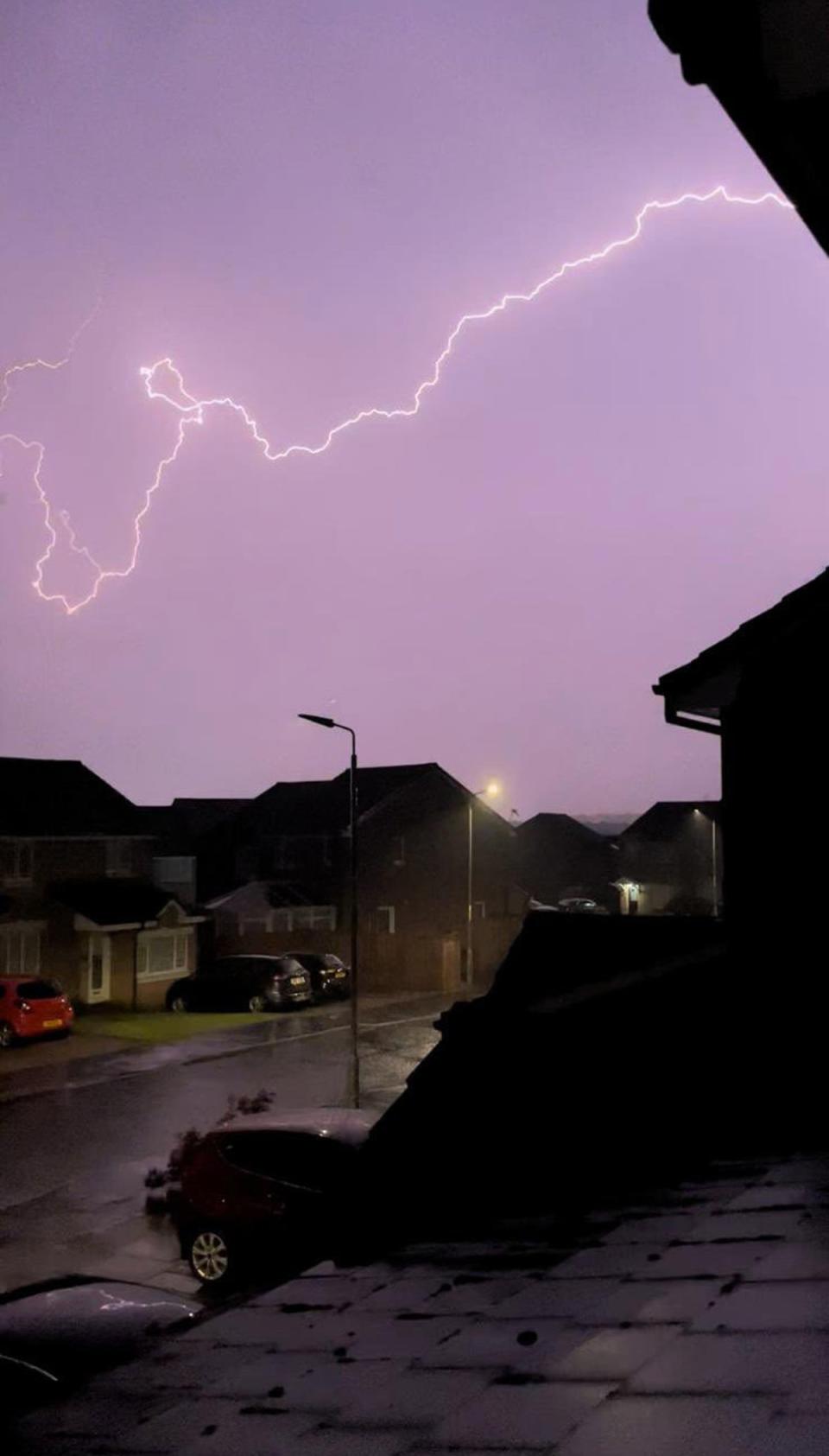 Lightning striking across Wishaw, North Lanarkshire, as the UK braces for days of rain (Zac Kennedy/PA) (PA Wire)