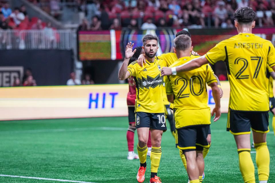 Jul 20, 2024; Atlanta, Georgia, USA; Columbus Crew forward Diego Rossi (10) reacts with teammates after scoring a goal against Atlanta United during the first half at Mercedes-Benz Stadium. Mandatory Credit: Dale Zanine-USA TODAY Sports