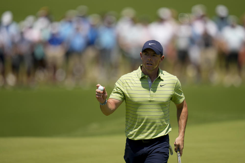 Rory McIlroy, of Northern Ireland, waves after making a putt on the first hole during the first round of the PGA Championship golf tournament, Thursday, May 19, 2022, in Tulsa, Okla. (AP Photo/Sue Ogrocki)