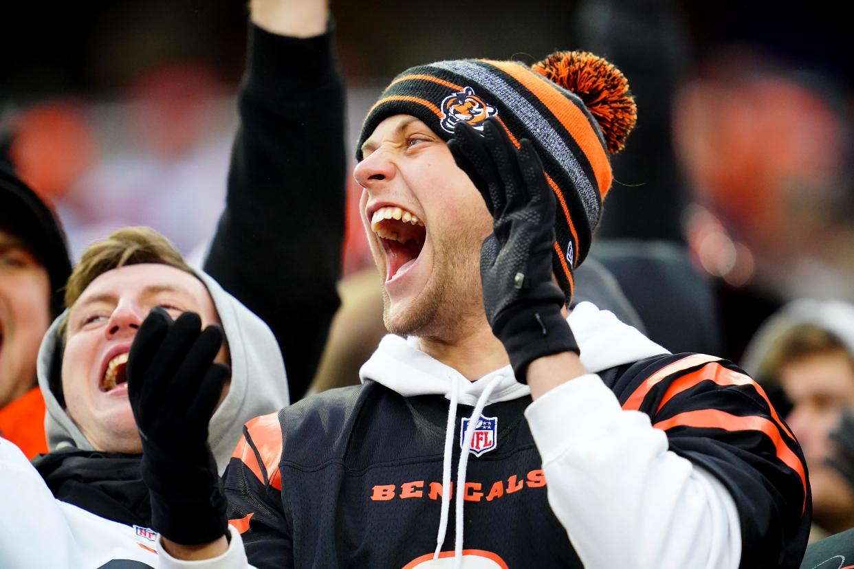 Cincinnati Bengals fans cheers on the team in the fourth quarter during a Week 17 NFL game against the Kansas City Chiefs, Sunday, Jan. 2, 2022, at Paul Brown Stadium in Cincinnati. The Cincinnati Bengals defeated the Kansas City Chiefs, 34-31. With the win the, the Cincinnati Bengals won the AFC North division and advance to the NFL playoffs. 