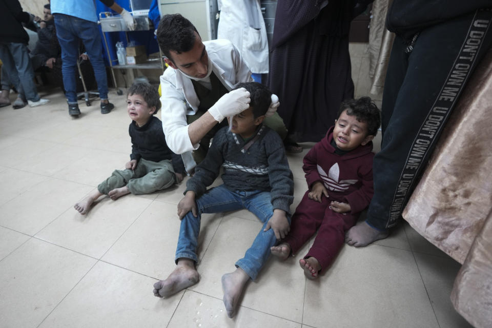 Palestinians wounded in the Israeli bombardment of the Gaza Strip are treated in a hospital in Deir al Balah on Sunday, Feb. 4, 2024. (AP Photo/Adel Hana)