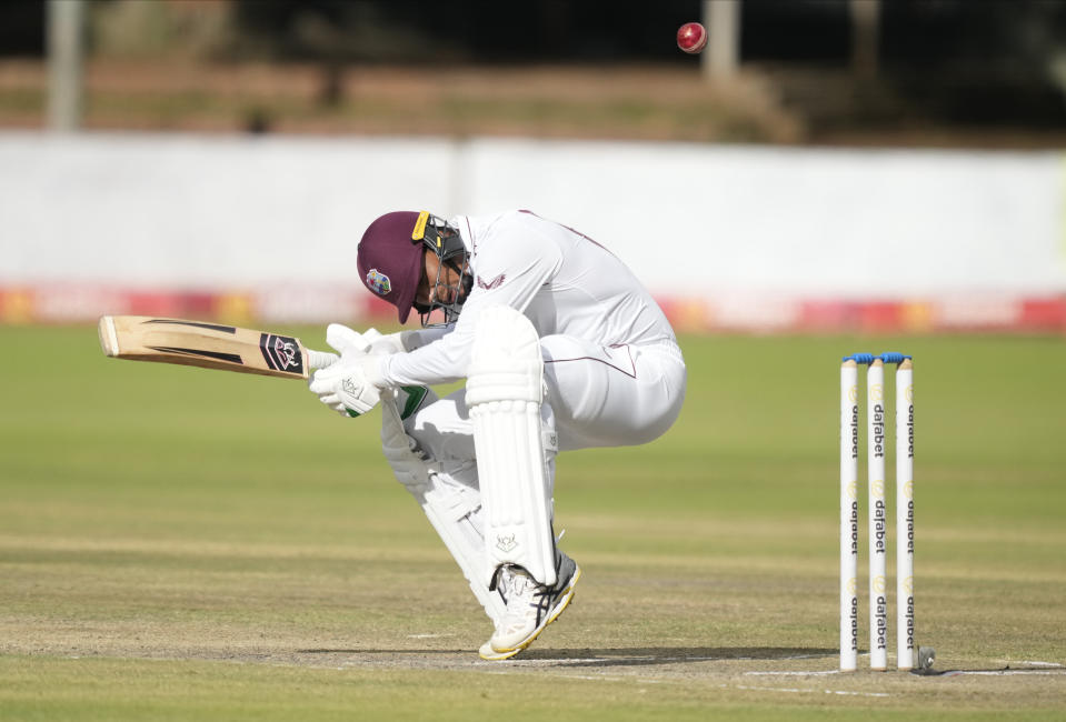 West Indies batsman Gudakesh Motie ducks the ball on the second day of the second Test cricket match between Zimbabwe and West Indies at Queens Sports Club in Bulawayo, Zimbabwe, Monday, Feb. 13, 2023. (AP Photo/Tsvangirayi Mukwazhi)