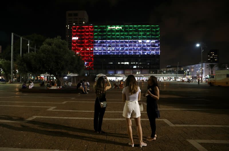 Tel Aviv's municipality building is lit in the Israeli and United Arab Emirates national flags following the announcement of a deal to normalise relations between the countries