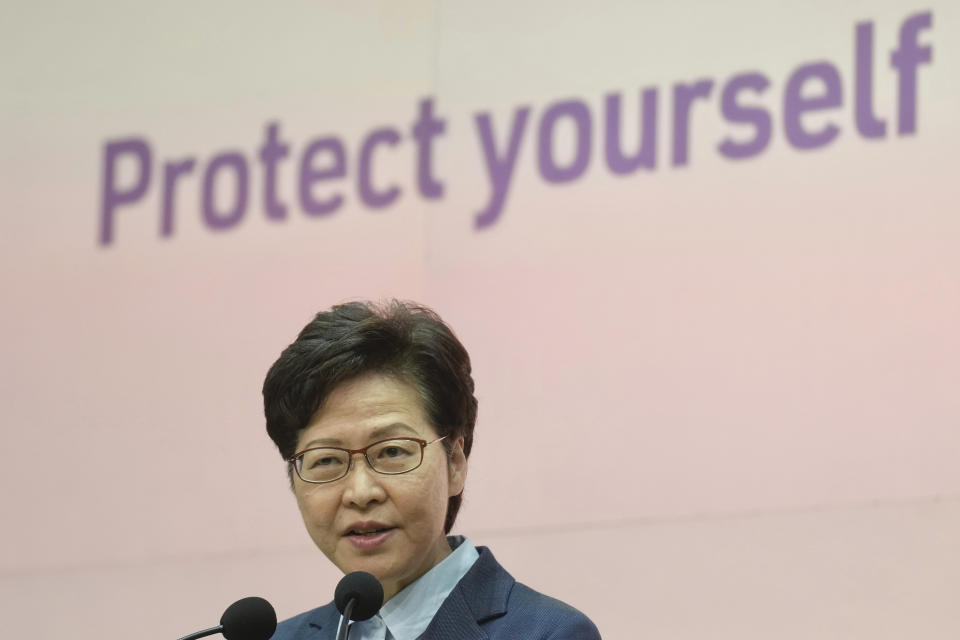 Hong Kong Chief Executive Carrie Lam listens to questions during a press conference in Hong Kong, Tuesday, May 25, 2021. Lam on Tuesday defended Hong Kong as an attractive place for businesses, after a recent survey found many foreigners were considering leaving the longtime Asian business hub. (AP Photo/Vincent Yu)