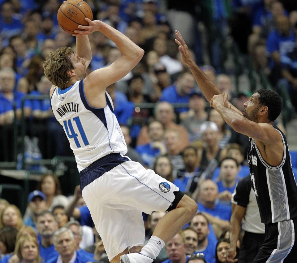 The Dallas Mavericks' Dirk Nowitzki (41) shoots a fade-away jumper over the San Antonio Spurs' Tim Duncan in Game 3 of of a Western Conference quarterfinal at the American Airlines Center in Dallas on Saturday April 26, 2014. (Ron Jenkins/Fort Worth Star-Telegram/Tribune News Service via Getty Images)