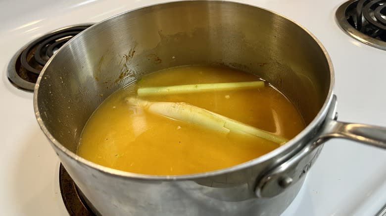 stock and lemongrass in saucepan