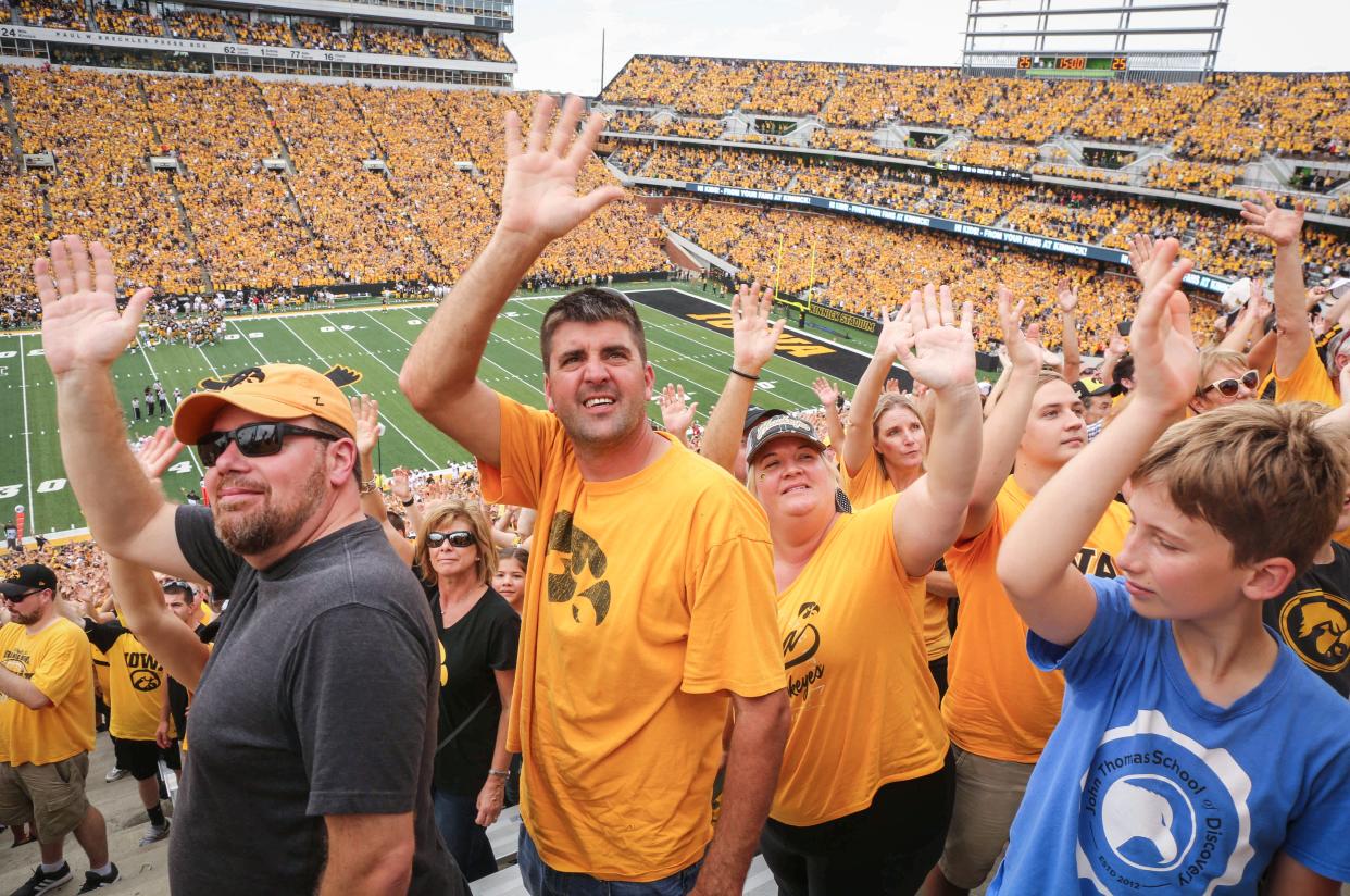 Hawkeye fans wave to the kids at the Children's Hospital after the first quarter against Northern Illinois on Saturday, Sept. 1, 2018, at Kinnick Stadium in Iowa City.