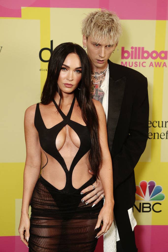 The couple posing together on the red carpet