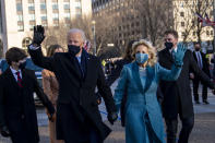 President Joe Biden, First Lady Jill Biden and family, walk near the White House during a Presidential Escort to the White House, Wednesday, Jan. 20, 2021 in Washington. (Doug Mills/The New York Times via AP, Pool)