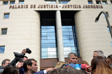 Criminal defense lawyer Agustin Martinez Becerra talks to reporters outside the High Court of Navarra before the verdict on five men accused of the multiple rape of a woman during Pamplona's San Fermin festival in 2016, in Pamplona, Spain, April 26, 2018. REUTERS/Vincent West