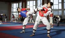 Tunisian Taekwondo athlete Khaoula Ben Hamza (in blue) trains during preparations for the 2012 London Olympic Games in Tunis May 25, 2012.