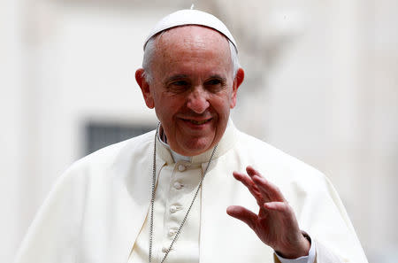 Pope Francis leaves at the end of his weekly audience in Saint Peter's Square at the Vatican May 11, 2016. REUTERS/Stefano Rellandini/File Photo