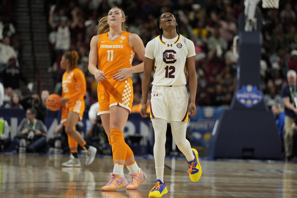 South Carolina guard MiLaysia Fulwiley (12) celebrates after scoring past Tennessee forward Karoline Striplin during the first half of an NCAA college basketball game at the Southeastern Conference women's tournament Saturday, March 9, 2024, in Greenville, S.C. (AP Photo/Chris Carlson)