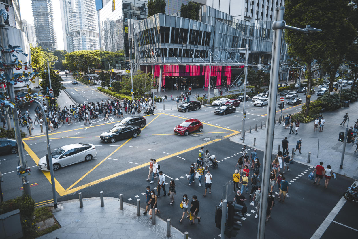 The Orchard Road crossing in Singapore is one of the busiest in the world, here seen an afternoon during the Covid-19 corona pandemics in October 2020. All people wearing masks to protect themselves.