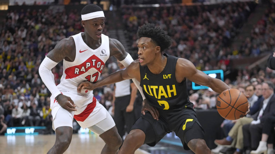 Toronto Raptors guard Dennis Schroder (17) defends against Utah Jazz guard Collin Sexton during the first half of an NBA basketball game Friday, Jan. 12, 2024, in Salt Lake City. (AP Photo/Rick Bowmer)