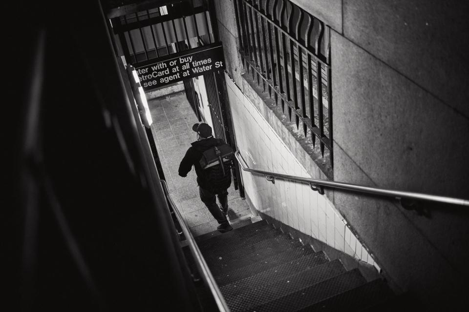 a person walking down a sidewalk