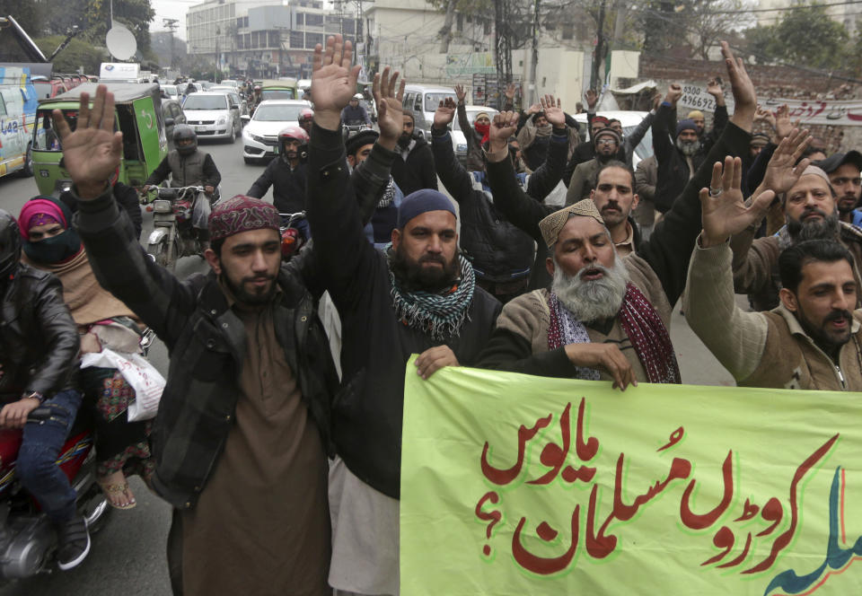 Activists from the Pakistani religious party Sunni Threek protest the Supreme Court's decision to uphold the acquittal of Aasia Bibi, in Lahore, Pakistan, Wednesday, Jan. 30, 2019. A radical Islamic party has asked its followers to hold nationwide protests Friday against the Supreme Court's recent decision of acquitting Bibi, a Christian woman, who spent eight precious years of her life on death row after being convicted in a controversial blasphemy case. Banner reads, "Muslims are disappointed." (AP Photo/K.M. Chaudhry)