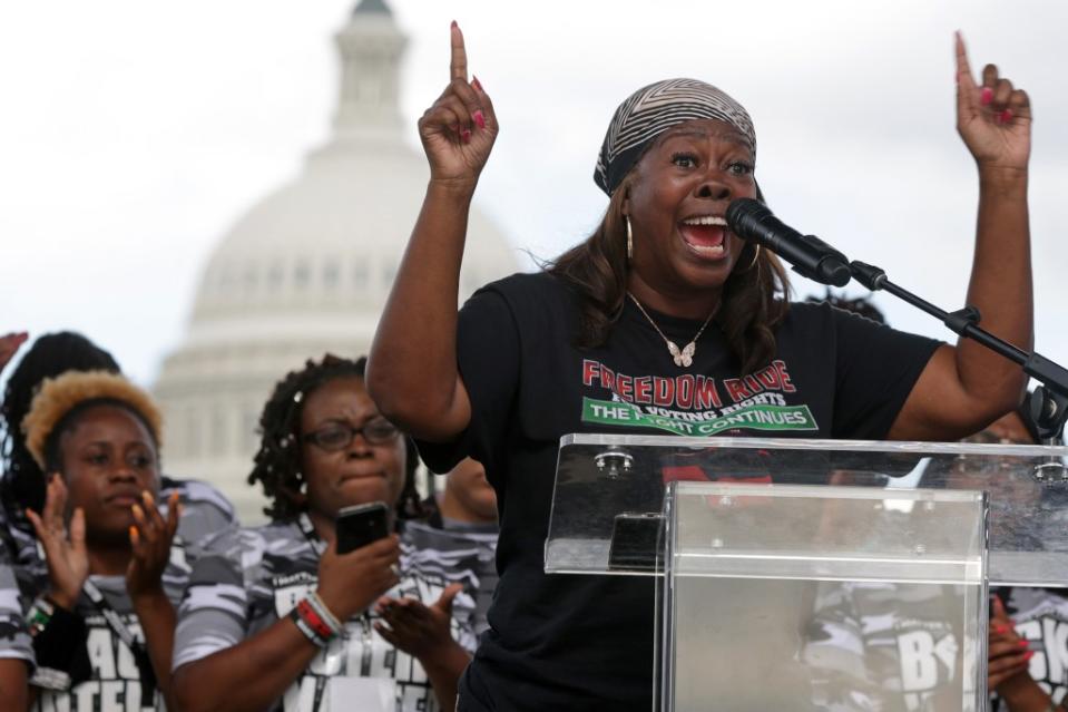 Co-founder of Black Voters Matter LaTosha Brown speaks as other voting rights activists listen during a “Rally for D.C. Statehood,” the last stop of BVM’s “Freedom Ride for Voting Rights” bus tour, at the National Mall June 26, 2021, in Washington, DC. (Photo by Alex Wong/Getty Images)